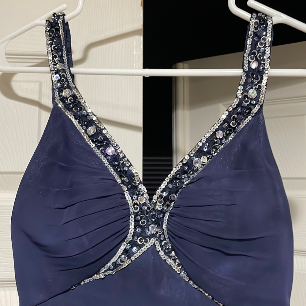 Evening gown- This is a stunning evening gown in navy blue with sequences.